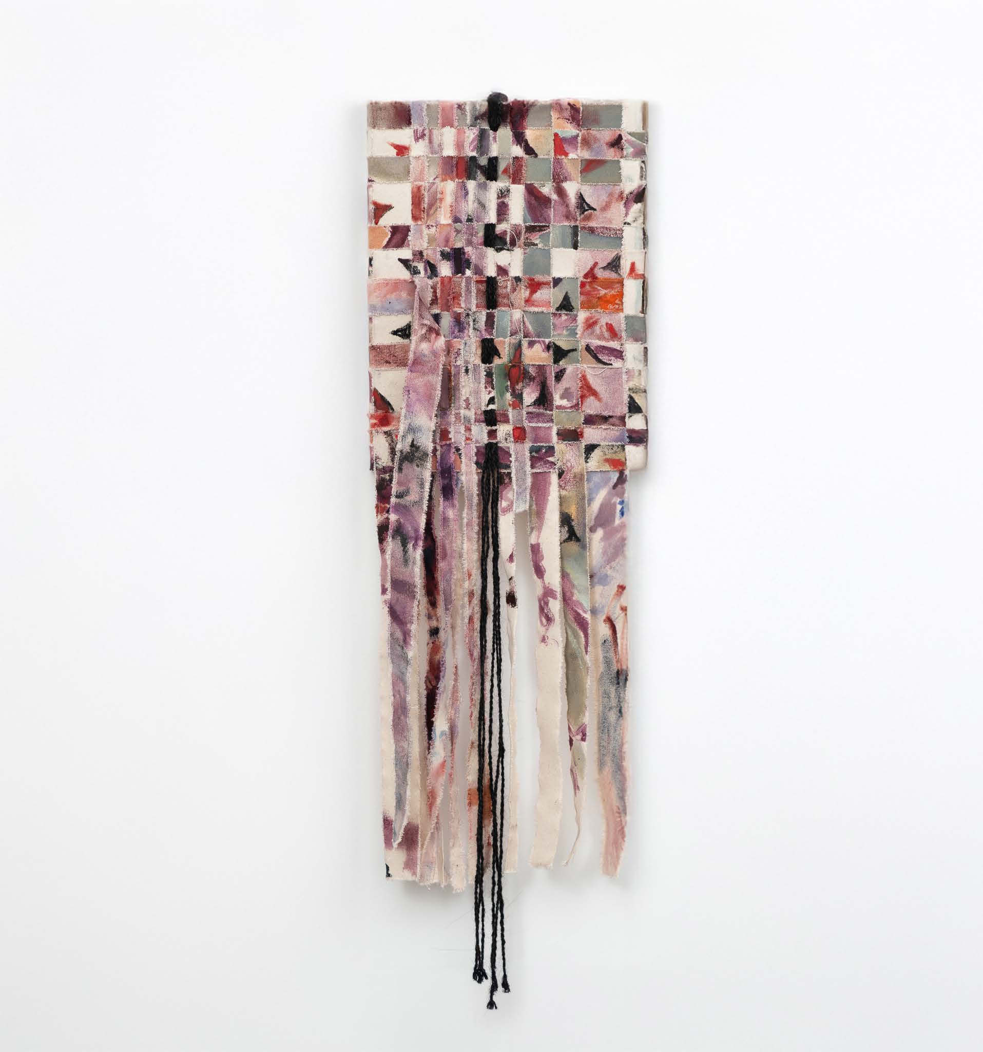 A narrow woven canvas in pale pink, green and black, with long fringes below.