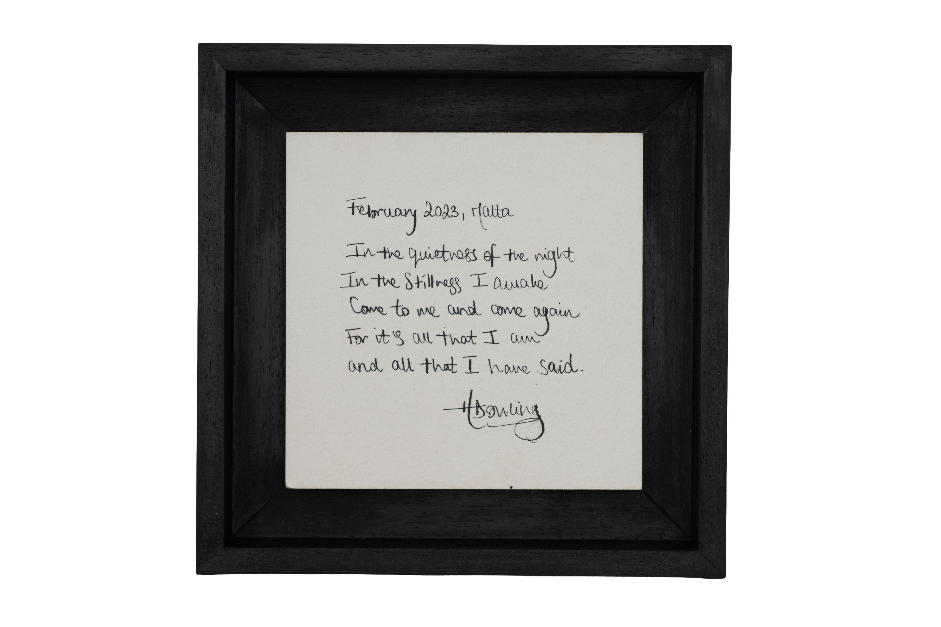 Hannah Dowling, February 2023, Malta. A square black frame containing a short handwritten poem on pale paper.
